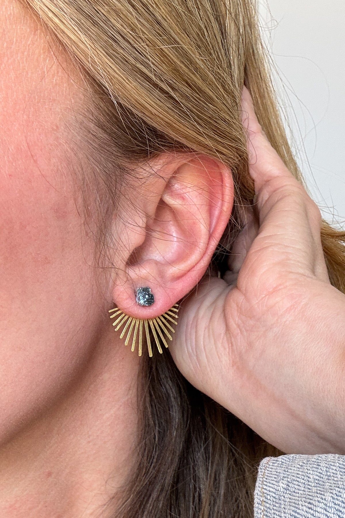 The Hillhurst Layered Studs feature a Bismuth stone with a raw brass burst that can be worn in front of or behind your earlobe. Make a statement with these ethically sourced earrings that were made in the USA.