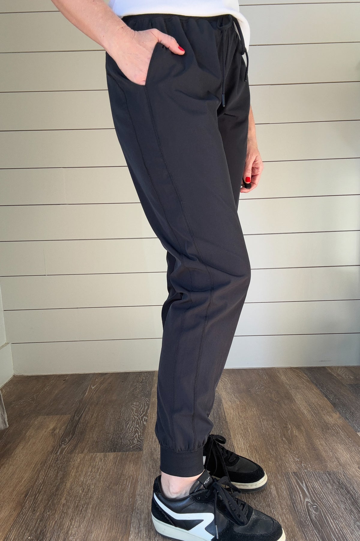 Jog into your days off in style with this luxuriously soft, effortlessly comfortable Black Athleisure Joggers..

It's elastic tie waist will ensure you look chic and comfortable no matter where your day takes you.

Boasting pockets at the hips, this jogger is perfect for a day of relaxing or running errands.