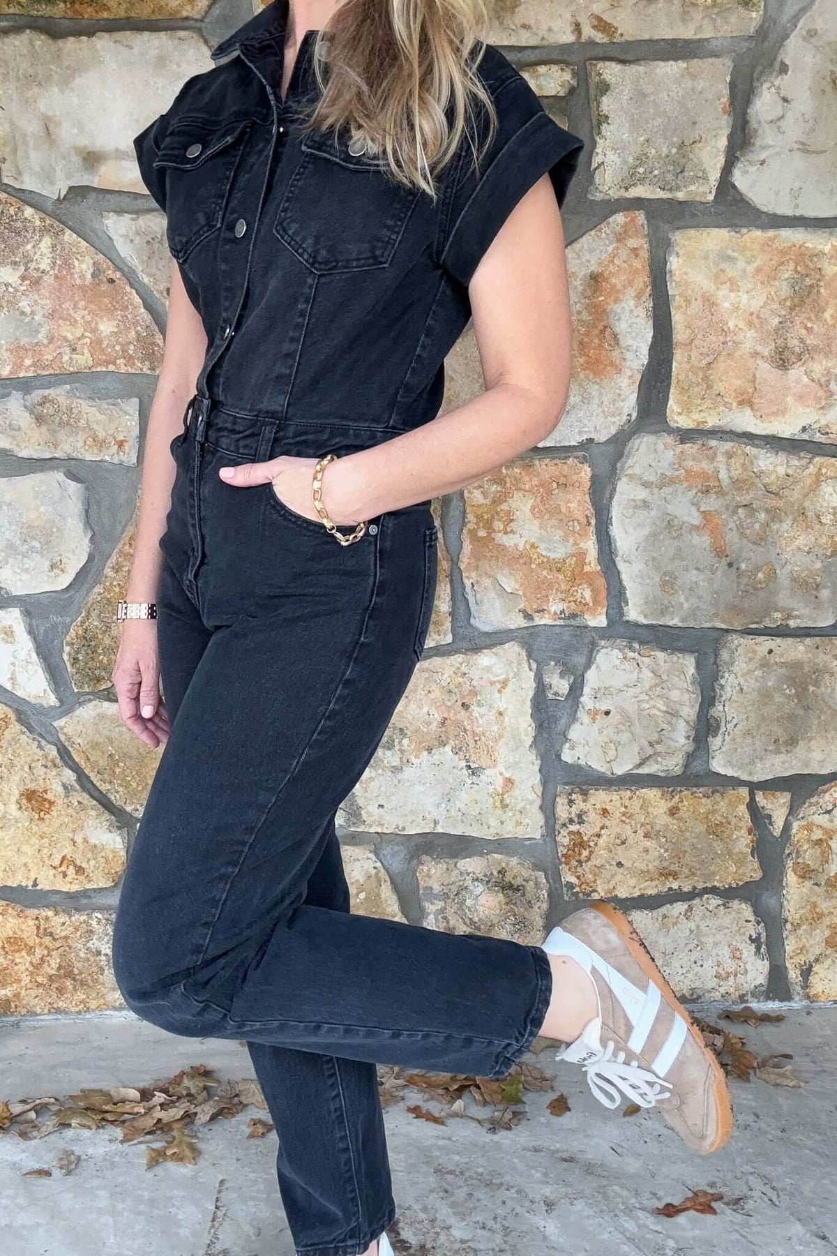 Experience ultimate comfort and style with our black denim Rolled Sleeve Jumpsuit. Crafted with a slight stretch for a perfect fit, this jumpsuit features roll short sleeves and a straight leg design.

Buttoned torso, zipper fly.


The sleeves are not tacked down, they can be unrolled for a slightly longer fit on the shoulder.