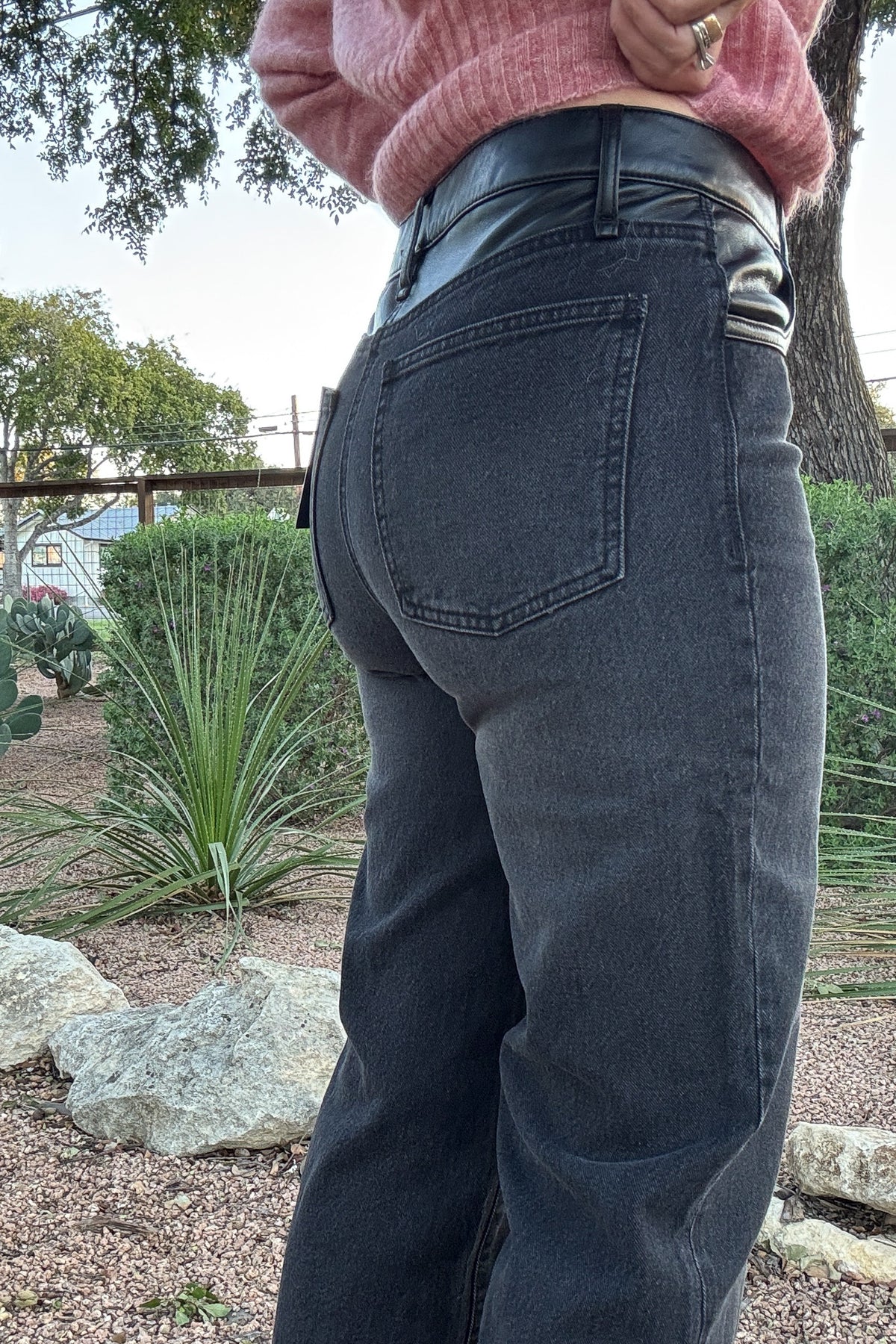 Women's charcoal gray jeans featuring a contrasting faux leather waistband, relaxed straight-leg fit, and traditional denim back pockets. Available at Cotton & Cashmere in Blanco, Texas.