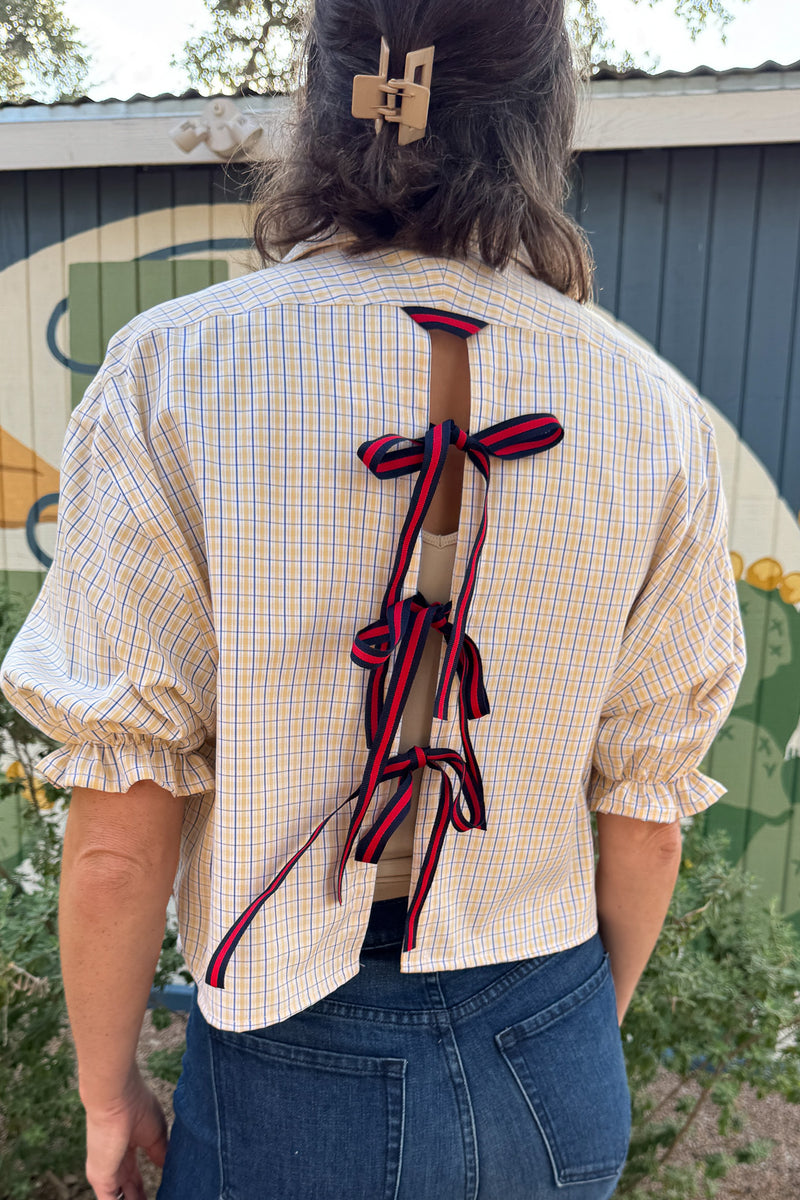 Women’s yellow and blue plaid Harlow top by VonVie featuring a relaxed cropped fit and open back with bow ties.