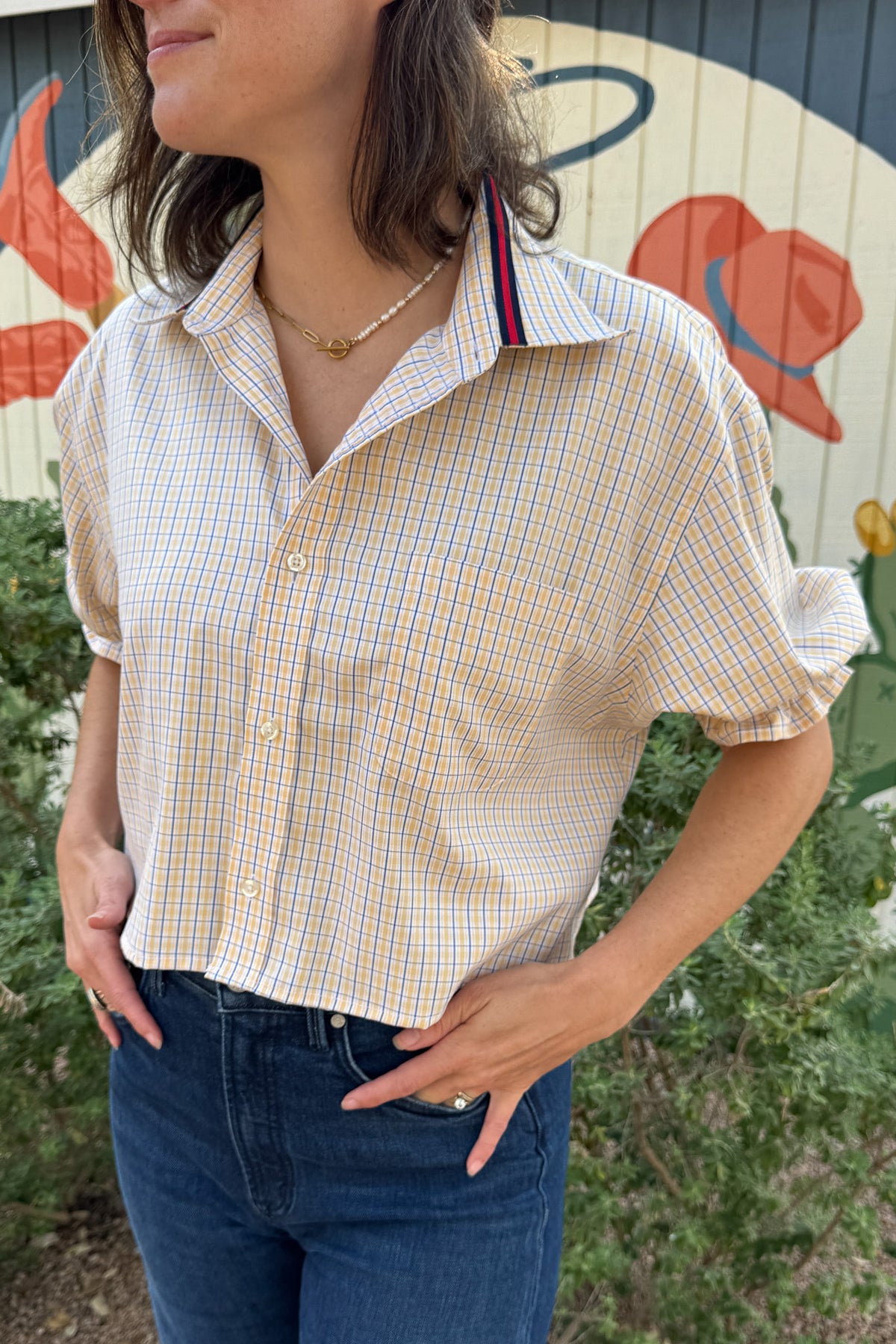 VonVie Harlow upcycled plaid top with button front, short puff sleeves, and contrasting ribbon tie-back detail.