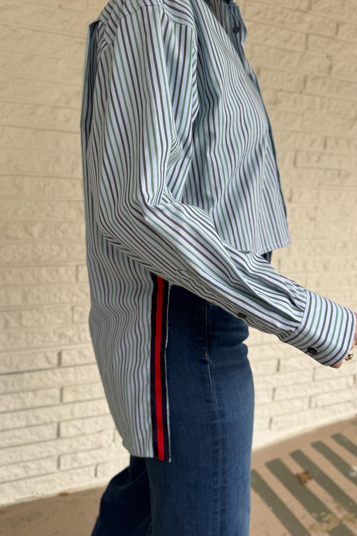 The modern Stormy button-down is designed to move with you for an easy, elevated feel. The cropped front flows into a longer back for a flattering high-low shape that adds interest to a classic style. Finished details give this piece a polished look that works dressed up or casual.