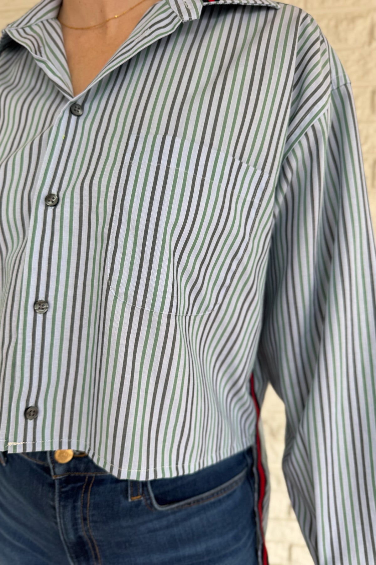 The modern Stormy button-down is designed to move with you for an easy, elevated feel. The cropped front flows into a longer back for a flattering high-low shape that adds interest to a classic style. Finished details give this piece a polished look that works dressed up or casual.