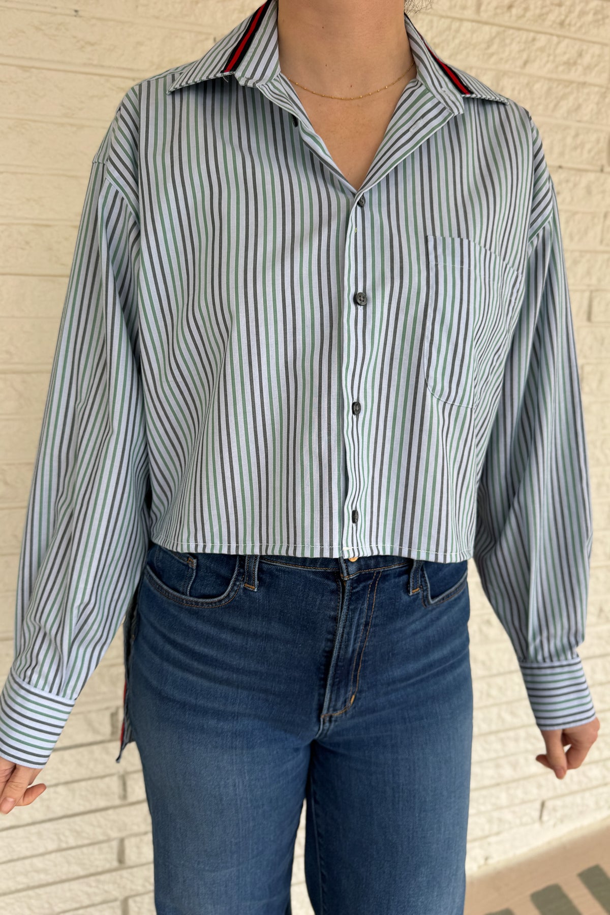 The modern Stormy button-down is designed to move with you for an easy, elevated feel. The cropped front flows into a longer back for a flattering high-low shape that adds interest to a classic style. Finished details give this piece a polished look that works dressed up or casual.