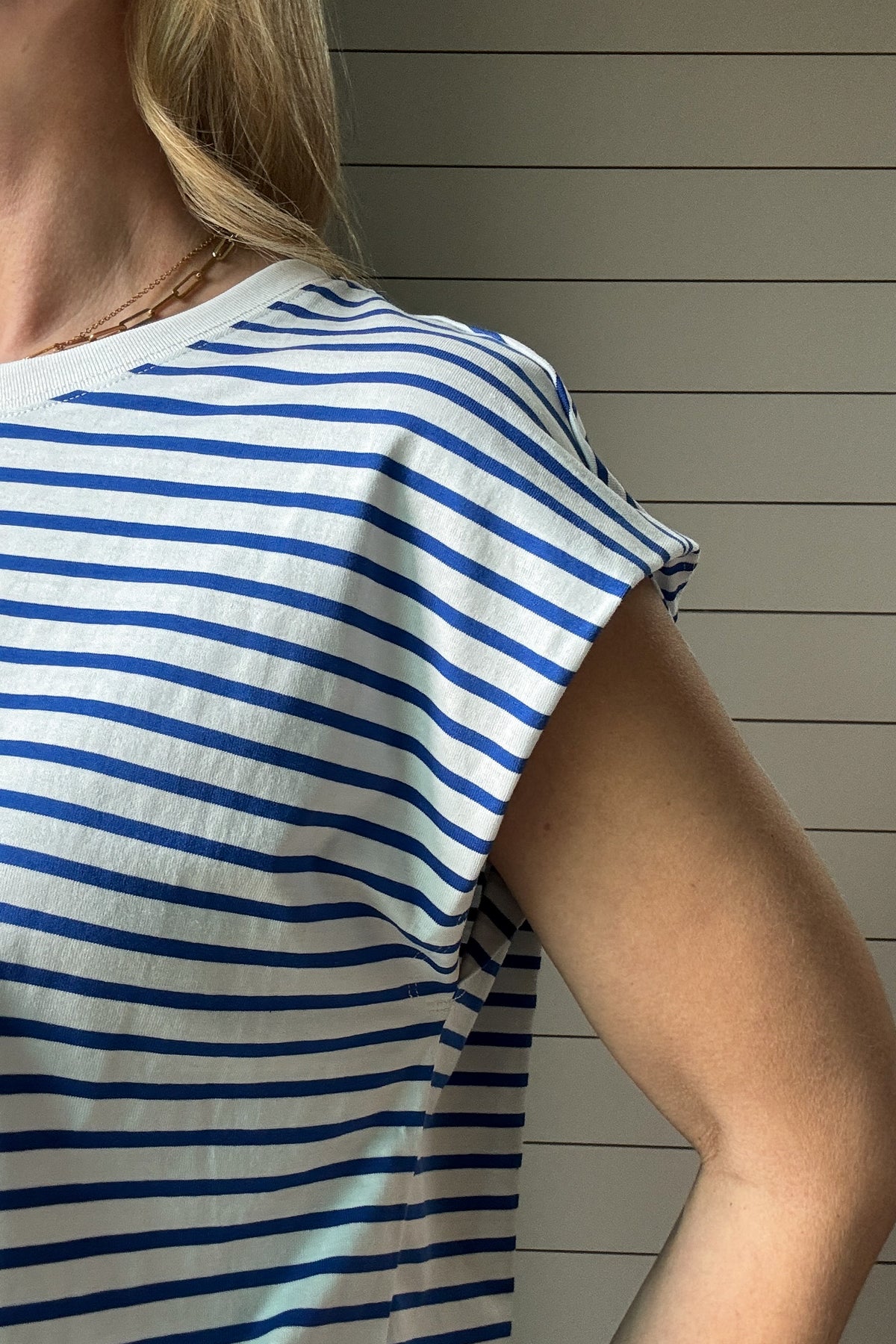 You're going to love this versatile top! Designed to be worn with a front tie or tucked in, this 100% cotton cap sleeve tee shirt is roomy, flattering and fun. The bright blue and white fabric is not see through and holds its shape beautifully. It is made to be worn on repeat. Brighten up your day with this top! Ships quickly from our warehouse in Texas.&nbsp;