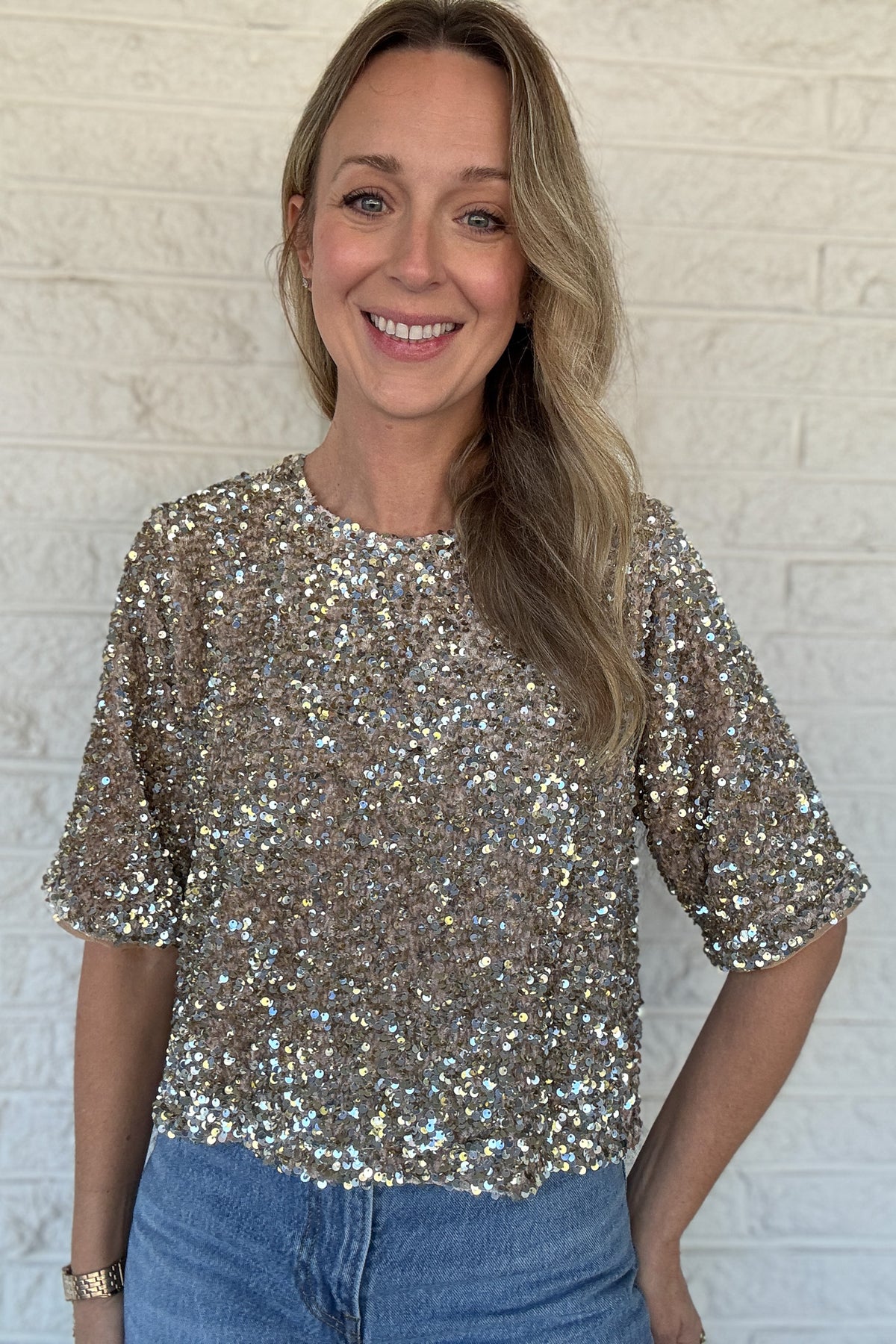 A little sparkle goes a long way. This fully lined sequin tee adds instant polish without sacrificing comfort. Designed with soft sleeve edging to keep sequins from scratching, it’s the kind of statement piece that feels as good as it looks. Dress it up with trousers or down with denim for easy, effortless style.