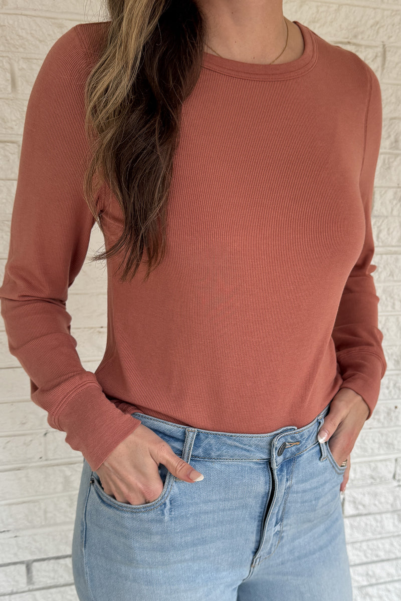 Soft, simple, and effortlessly flattering — this long sleeve top is your new everyday go-to. Made from luxe micro modal with a hint of stretch, it drapes beautifully and feels silky smooth against the skin. Perfect for layering or wearing solo with your favorite denim.