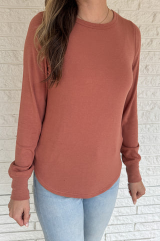 Soft, simple, and effortlessly flattering — this long sleeve top is your new everyday go-to. Made from luxe micro modal with a hint of stretch, it drapes beautifully and feels silky smooth against the skin. Perfect for layering or wearing solo with your favorite denim.