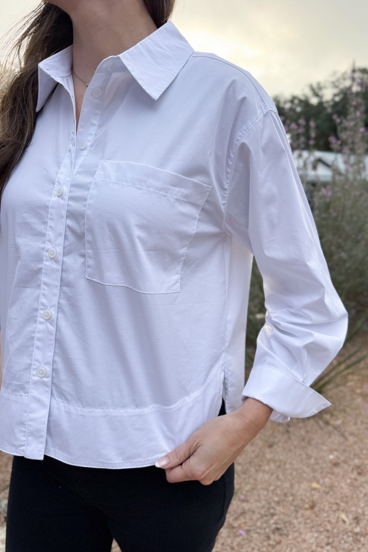 Your go to white blouse when you want clean, effortless style. Designed with a high/low hem for easy movement and a relaxed, modern drape. Lightweight with just a touch of stretch, it’s perfect for everyday wear;&nbsp; polished enough for meetings, easy enough for school drop-off and errands.