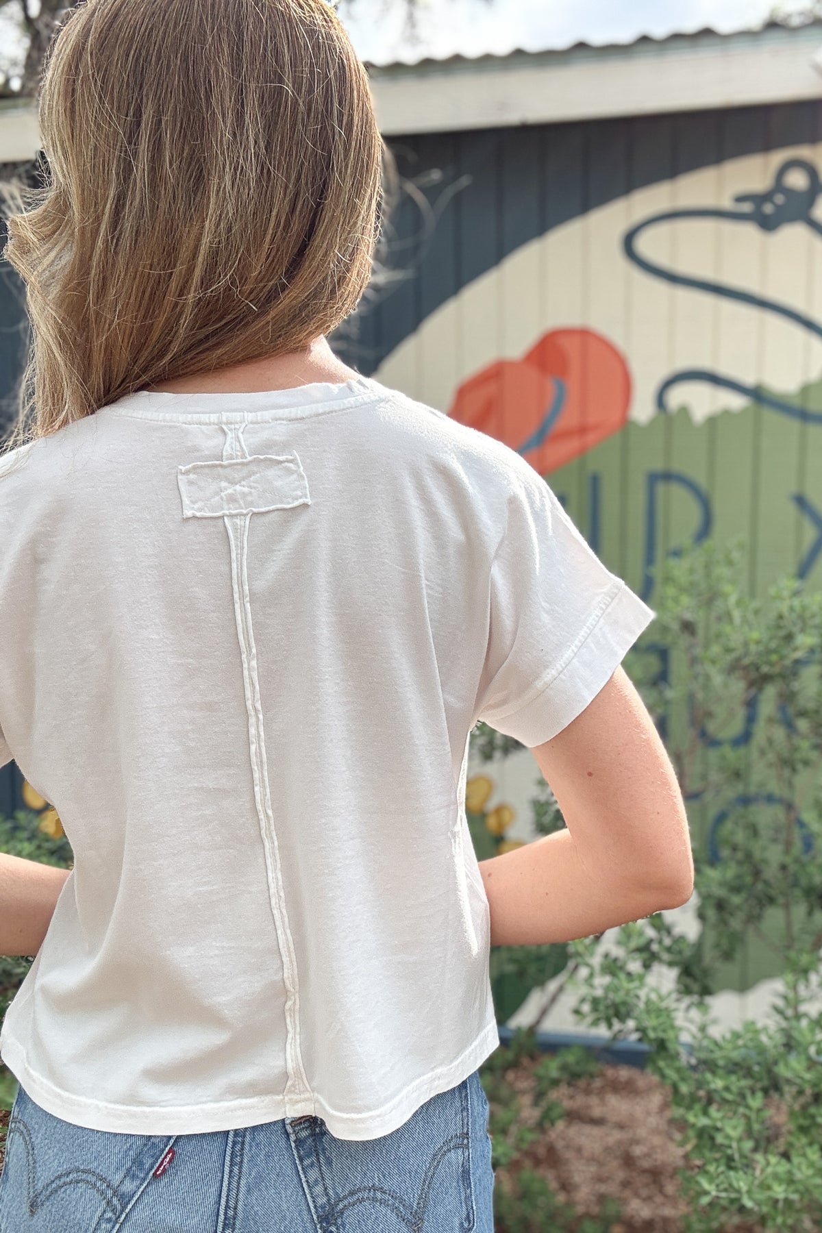 white cotton tee, women’s cotton clothing, cotton clothing, boxy tee, cap sleeve tee, effortless style, everyday style, sustainable women’s fashion, made in USA clothing, quality women’s clothing, clothing store near me, women’s clothing near me, Blanco TX boutique, Cotton and Cashmere 