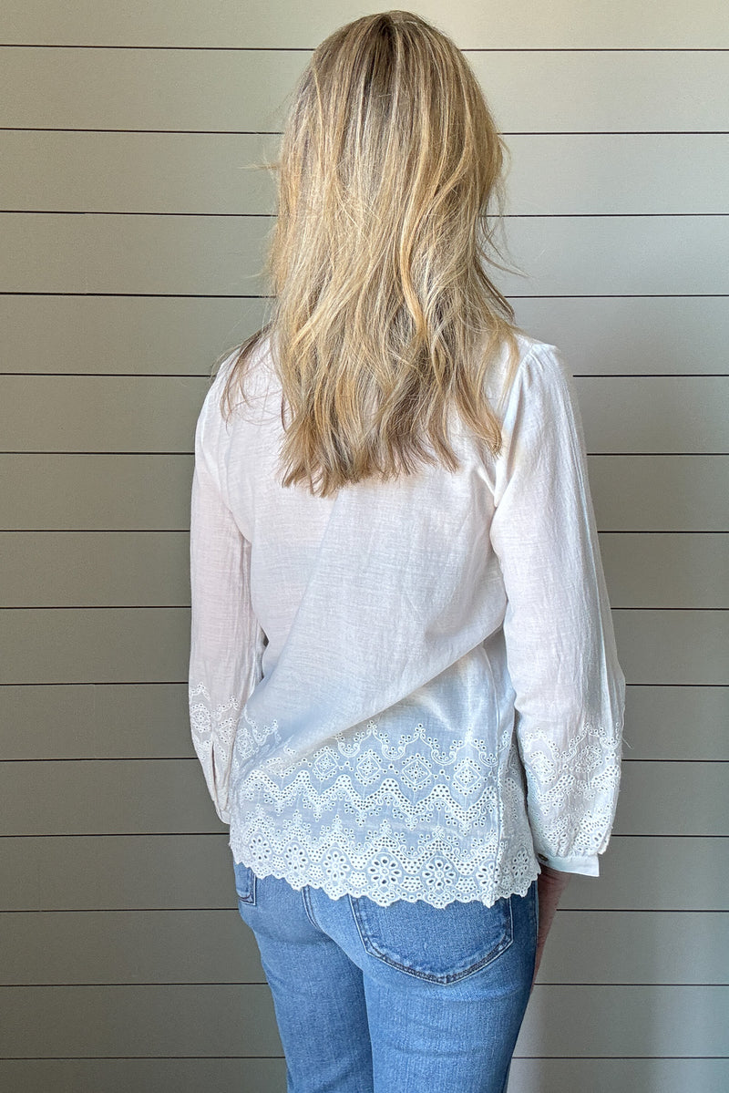 This 100% organic cotton blouse is the perfect blend of delicate charm and effortless style. Designed with intricate eyelet detailing, it adds a feminine touch to any look. The lightweight, breathable fabric makes it a go-to for warm days, while the soft cotton keeps you comfortable all day long.