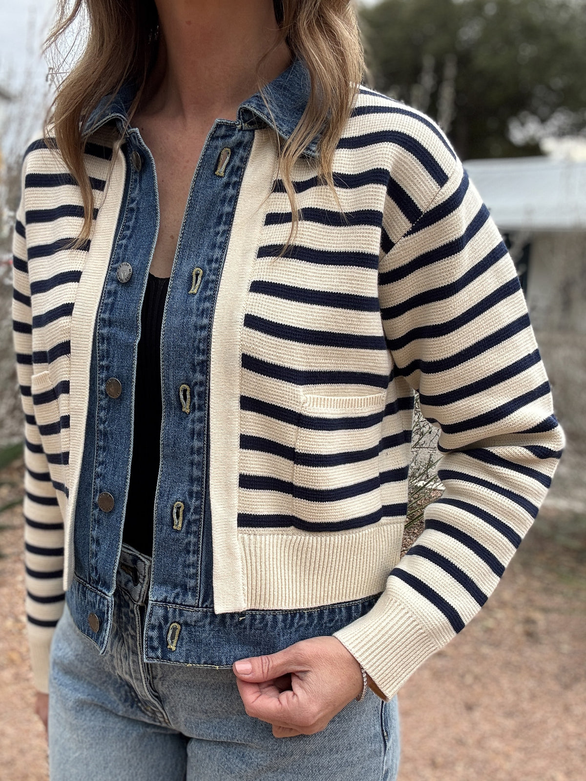 This Velvet Heart jacket is a playful twist on classic layering. Designed to look like a striped sweater over a denim jacket, it’s actually one lightweight piece for easy wear without bulk. Cream and navy knit stripes add a nautical touch, while the denim front and collar bring structure and texture. Style it with denim for a relaxed double-denim look or layer it over a dress for effortless contrast. Comfortable, versatile, and easy to wear.&nbsp;
