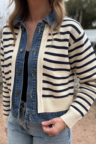 This Velvet Heart jacket is a playful twist on classic layering. Designed to look like a striped sweater over a denim jacket, it’s actually one lightweight piece for easy wear without bulk. Cream and navy knit stripes add a nautical touch, while the denim front and collar bring structure and texture. Women's fashion boutique Blanco Texas Johnson City Texas