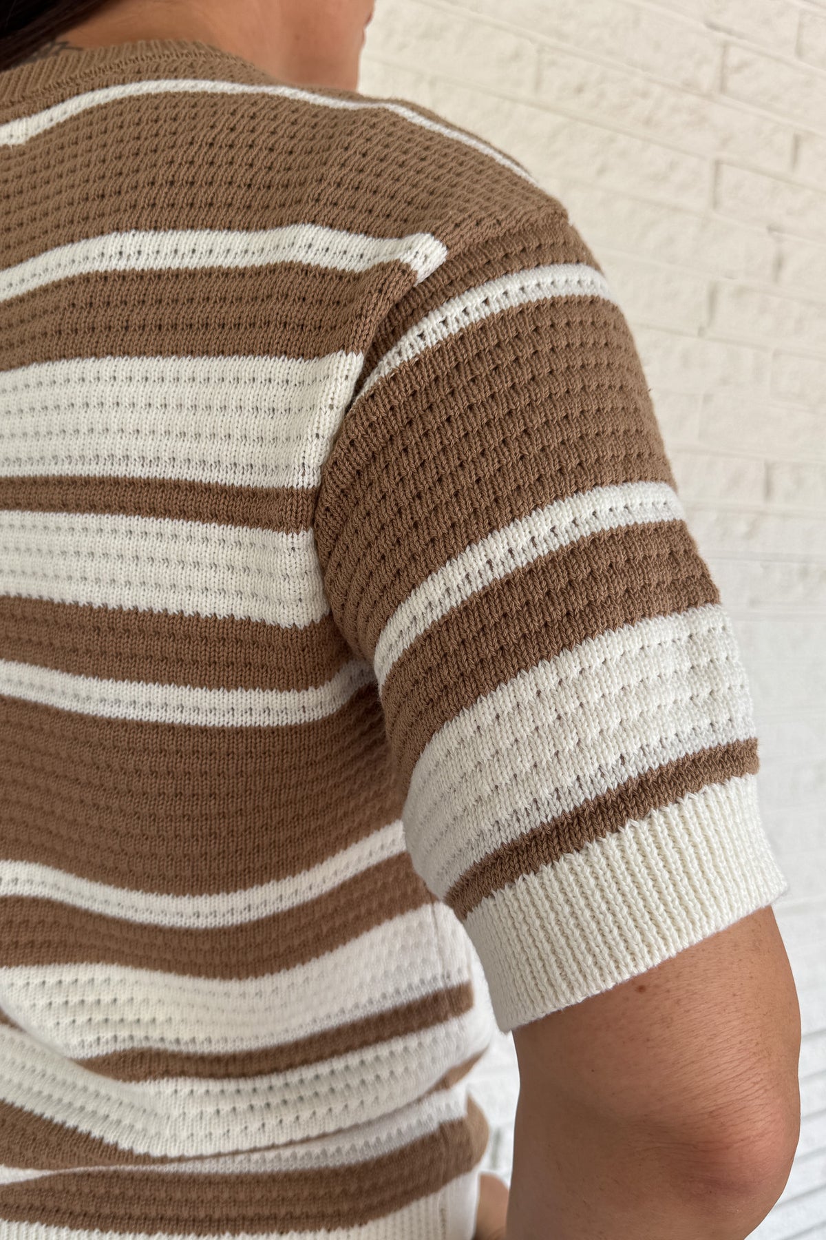 Classic stripes meet everyday comfort in this 100% cotton knit top. With its breathable open-knit texture and short sleeves, it’s an easy choice for effortless clothing that works from season to season. A timeless neutral palette keeps it versatile for everyday wear.
