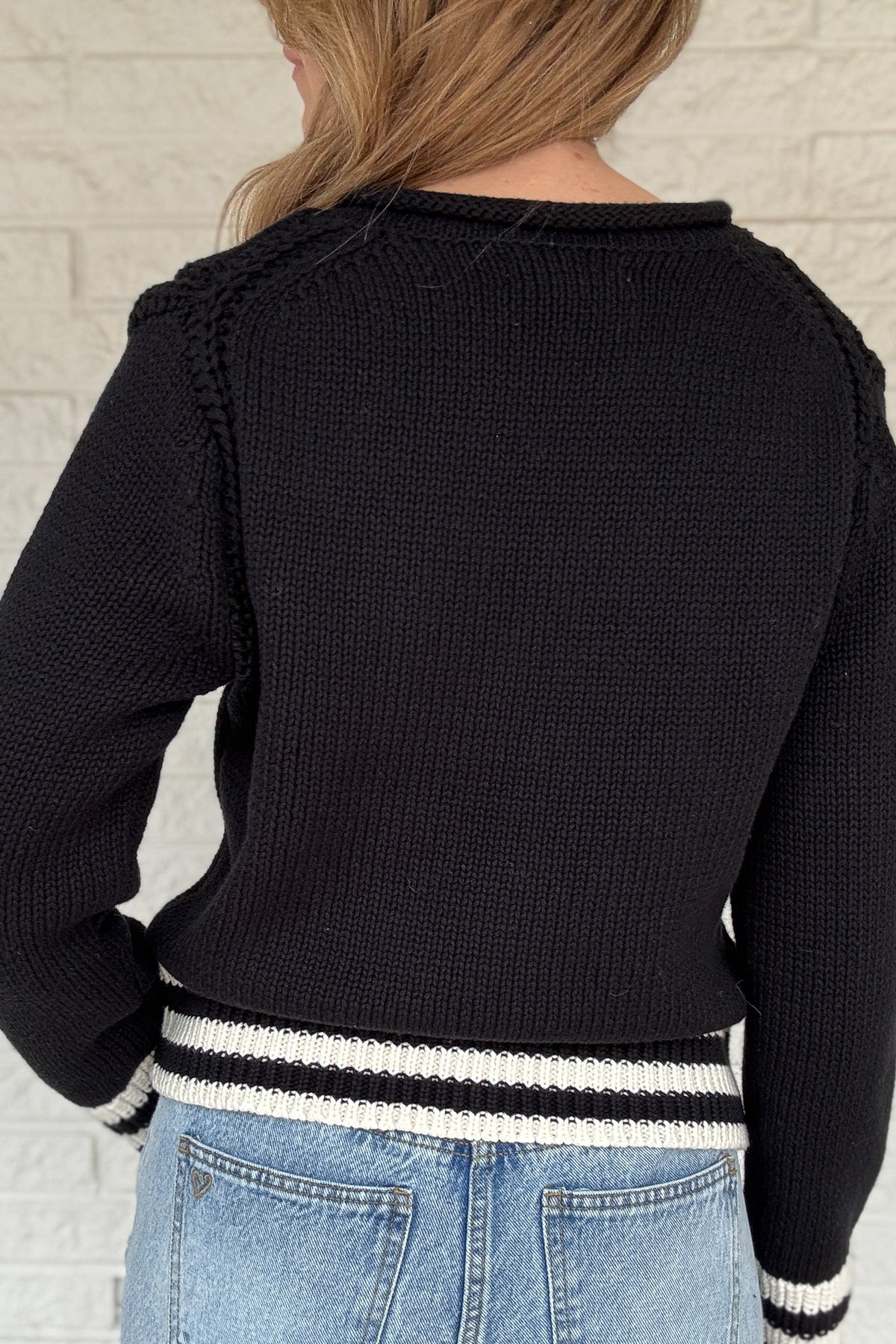 This classic striped knit is the kind of sweater you’ll wear all season long. Made from a heavy 100% cotton knit, it has a cozy, substantial feel without being bulky. The contrast stripes at the hem and cuffs add a clean, sporty touch that keeps it timeless and easy.