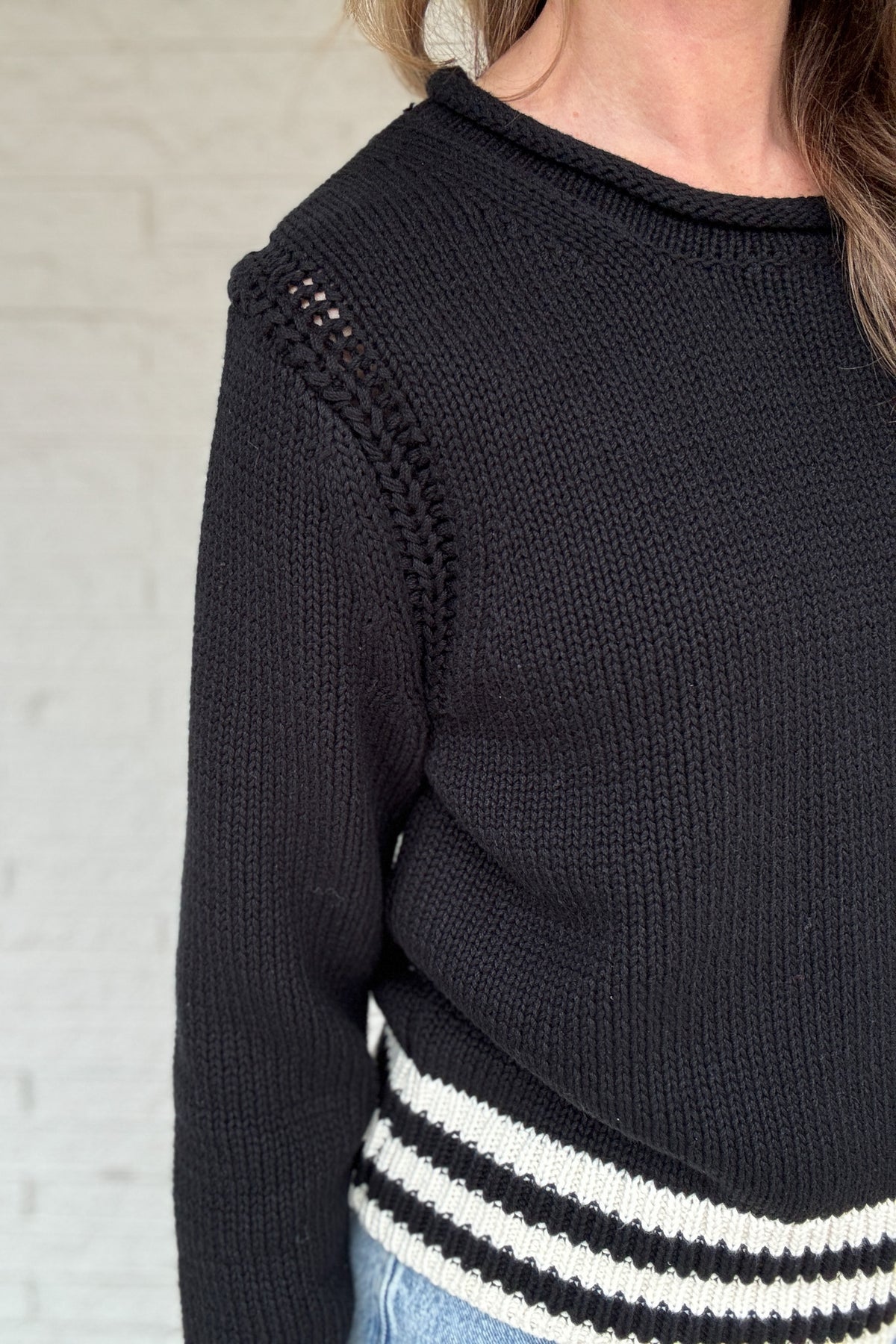 This classic striped knit is the kind of sweater you’ll wear all season long. Made from a heavy 100% cotton knit, it has a cozy, substantial feel without being bulky. The contrast stripes at the hem and cuffs add a clean, sporty touch that keeps it timeless and easy.