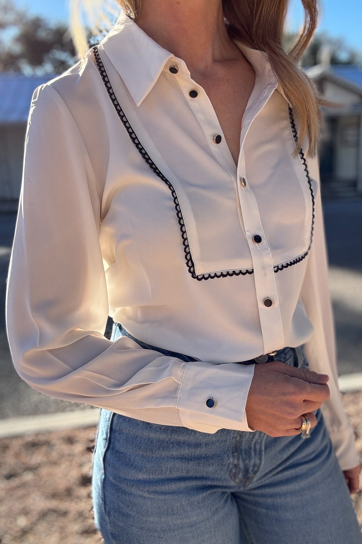 women's cream blouse with black details