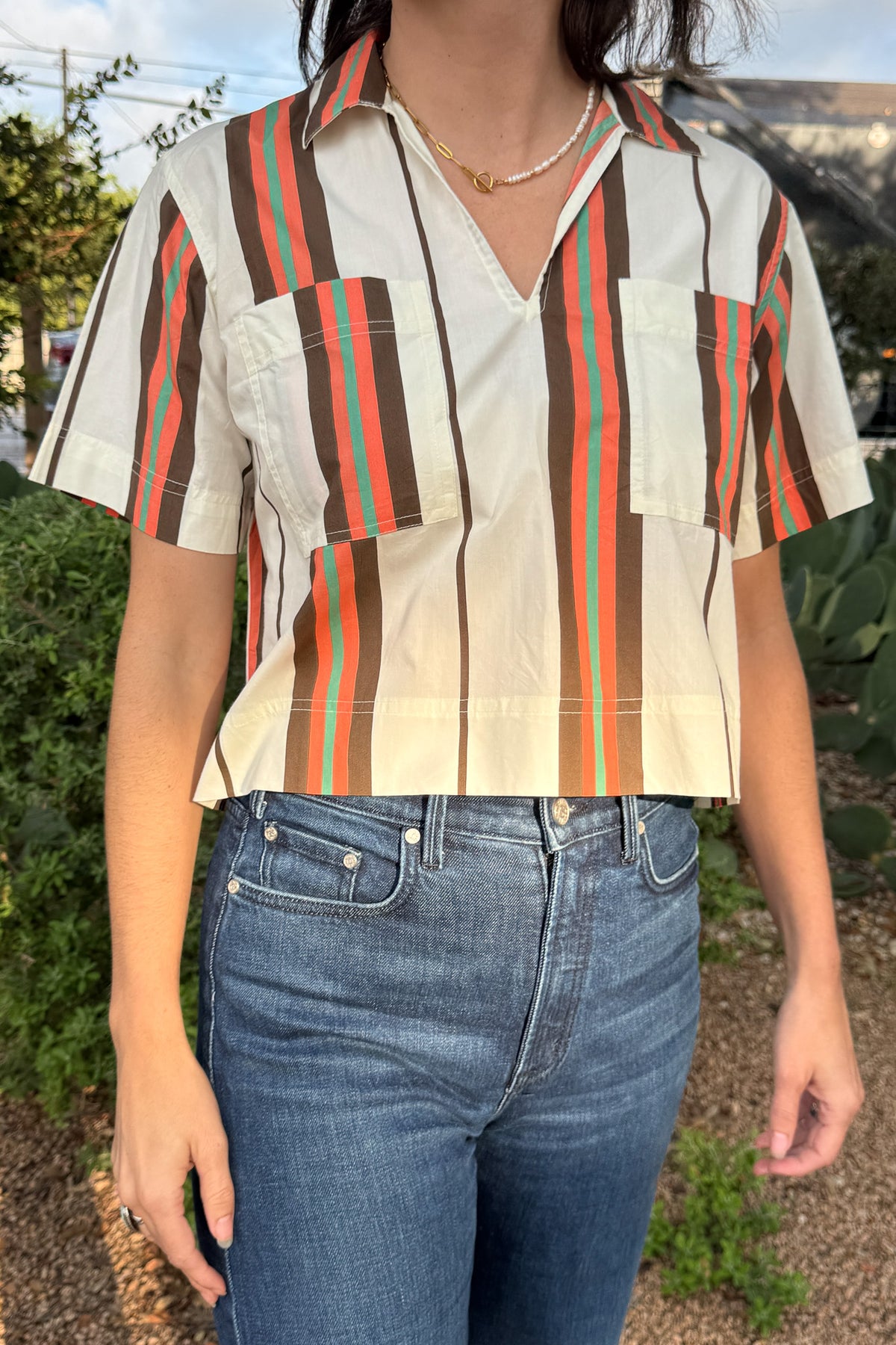 Vintage-inspired striped cotton top with a boxy fit, relaxed collar, and patch pocket detail, available at Cotton & Cashmere in Blanco, Texas.