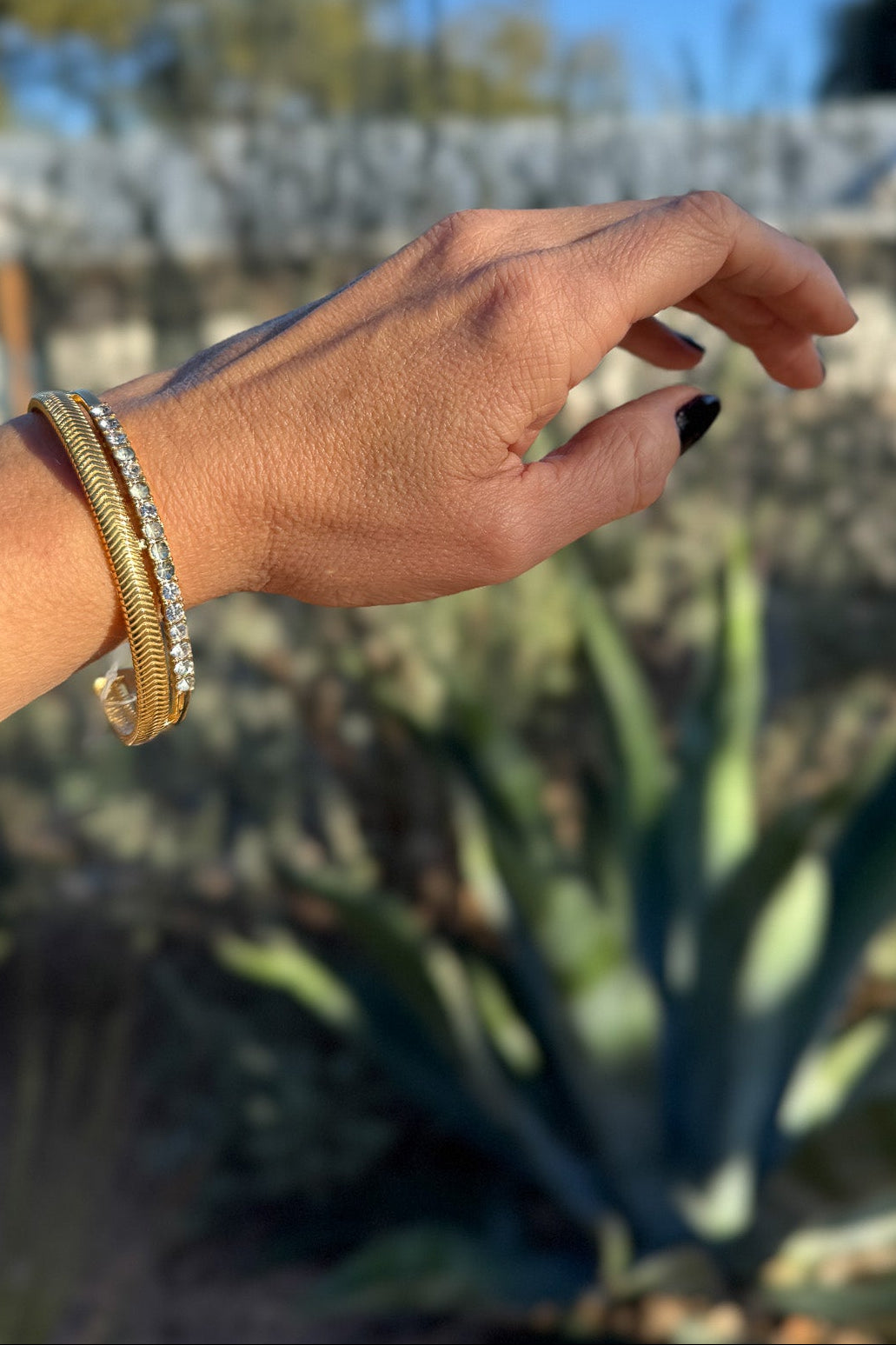 This double-stacked crystal cuff brings the perfect mix of sophistication and edge. With one textured band and one lined in sparkling crystals, it’s the ultimate statement piece—effortless for both casual days and dressy nights. A little girly, a little grunge, totally timeless.