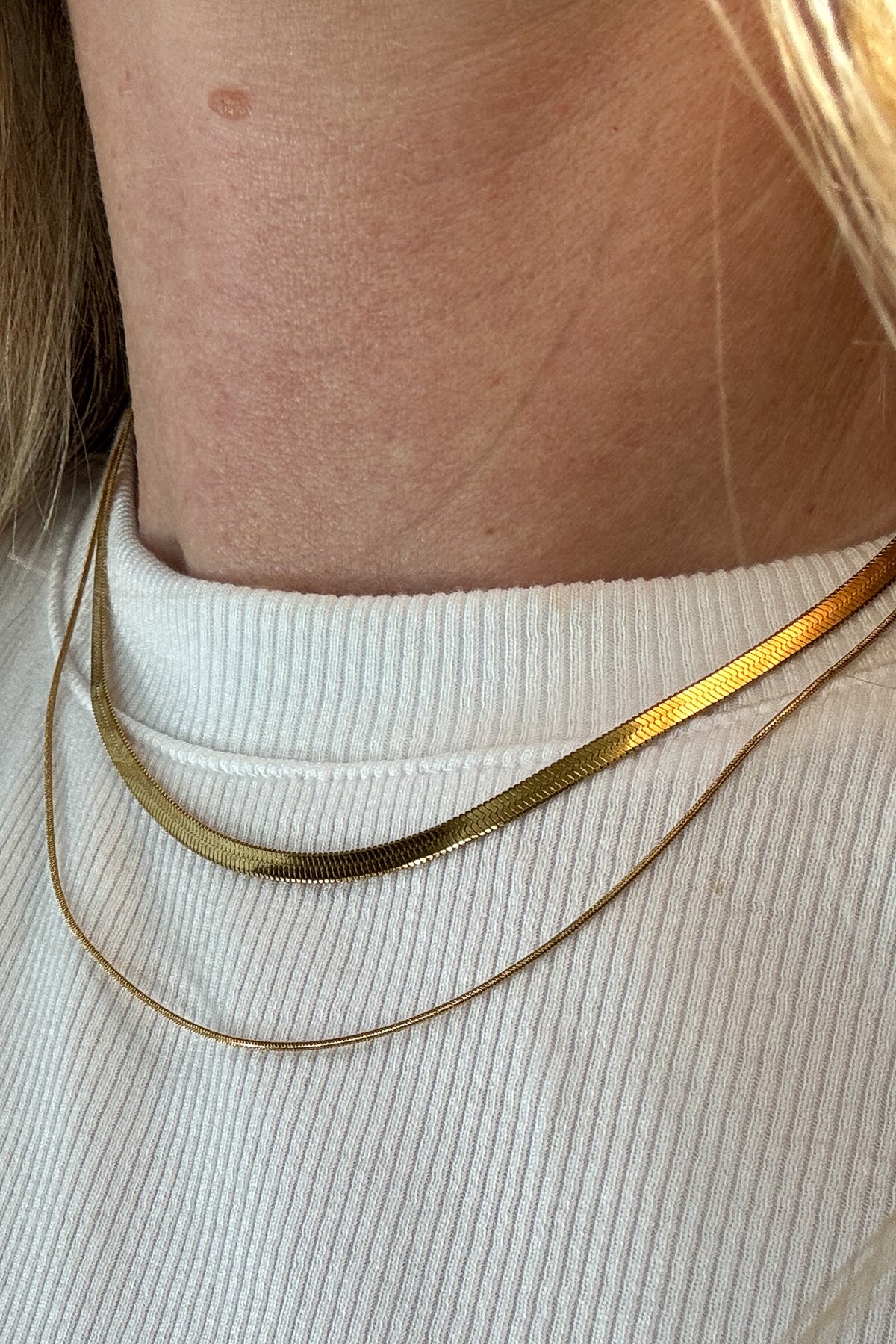 The string along necklace features five slim rope chains.&nbsp;

18k gold plated or stainless steel
water proof
adjustable 14.5" - 16.5"
nickel / lead free
made with materials ethically sourced