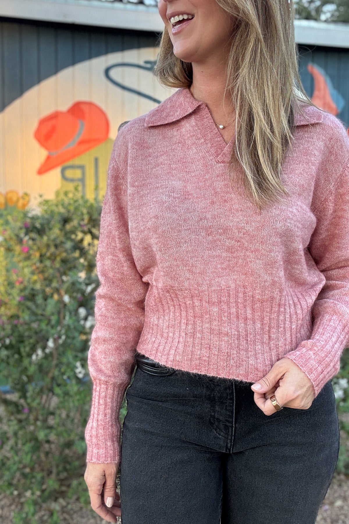 Women's dusty pink knit sweater with a collared V-neckline, long sleeves, and ribbed waist. Shop Cotton & Cashmere Boutique.