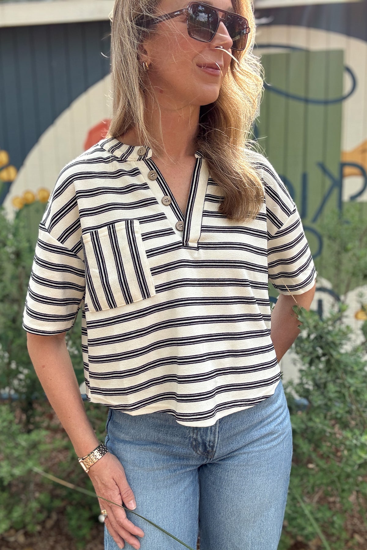 striped knit top, black and white striped sweater top, v neck knit top, boxy knit top, button front knit top, women’s striped top, casual knit top, everyday knitwear, lightweight sweater top, relaxed fit top, soft stretch sweater, neutral stripe top  