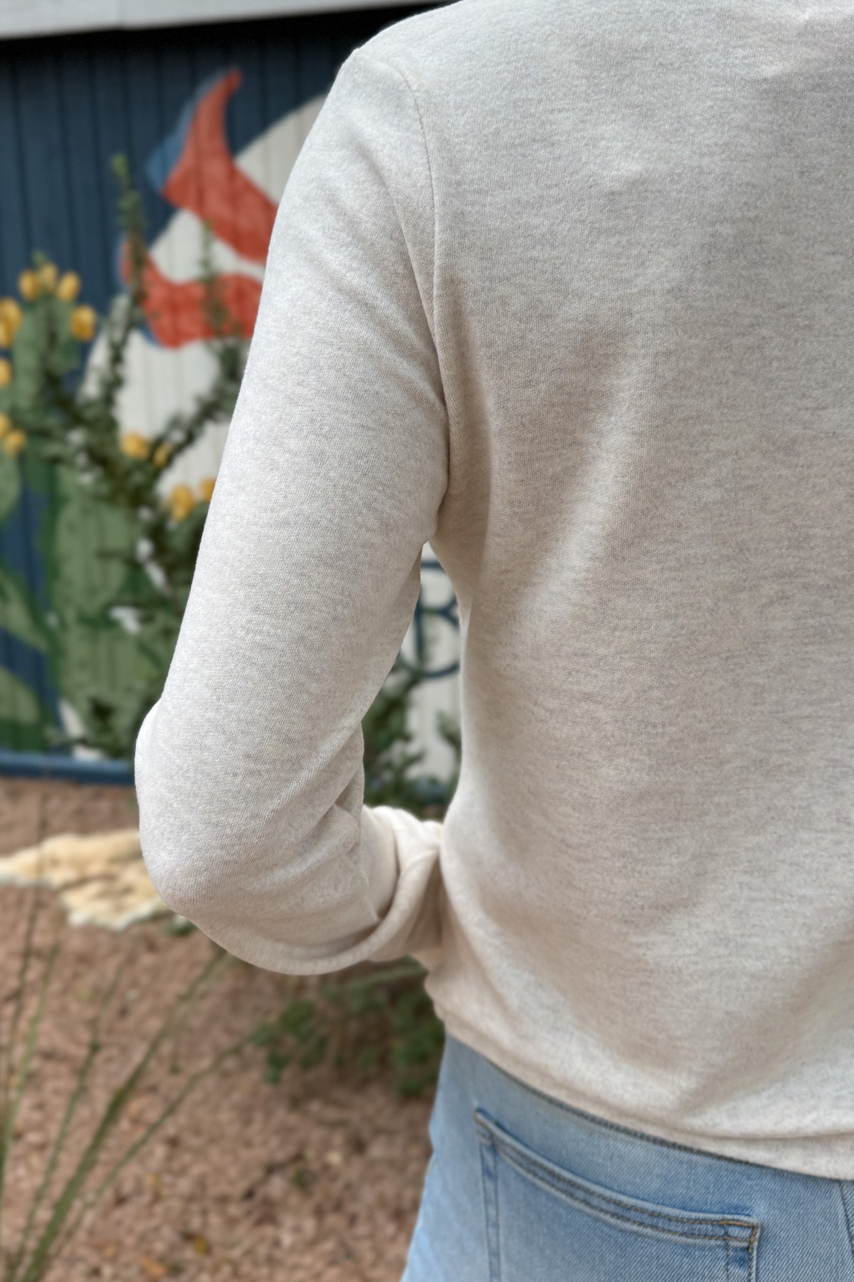 An easy everyday staple, this soft henley top blends laid-back comfort with a polished touch. Designed with a four-button neckline and subtle heathered texture, it’s the perfect piece for layering or wearing solo.