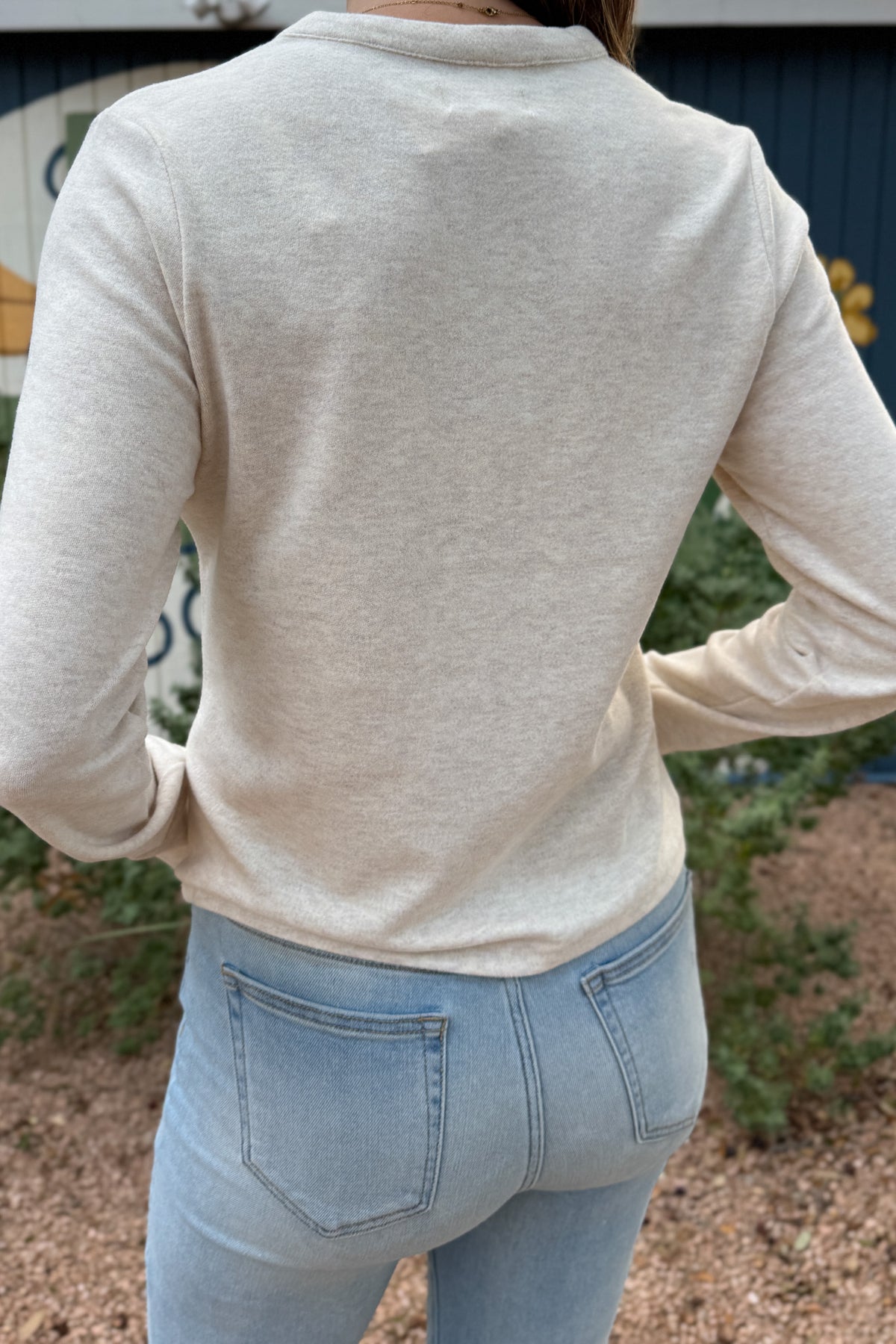 An easy everyday staple, this soft henley top blends laid-back comfort with a polished touch. Designed with a four-button neckline and subtle heathered texture, it’s the perfect piece for layering or wearing solo.