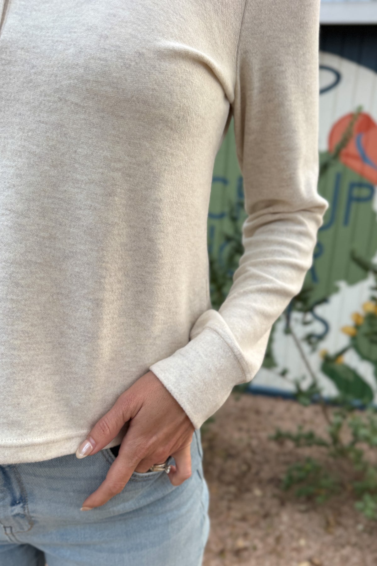 An easy everyday staple, this soft henley top blends laid-back comfort with a polished touch. Designed with a four-button neckline and subtle heathered texture, it’s the perfect piece for layering or wearing solo.