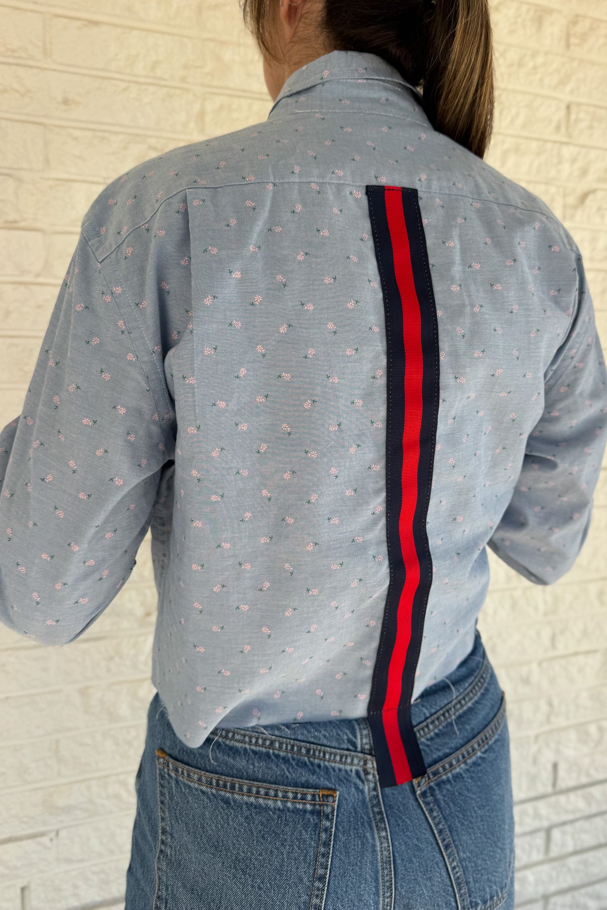 An upcycled men’s shirt reworked into a cropped, raw hem, easy silhouette that feels fresh and relaxed. Soft, feminine, and one-of-a-kind. Designed to be a one size fits most when worn open, wear it buttoned up and it fits like small or medium.