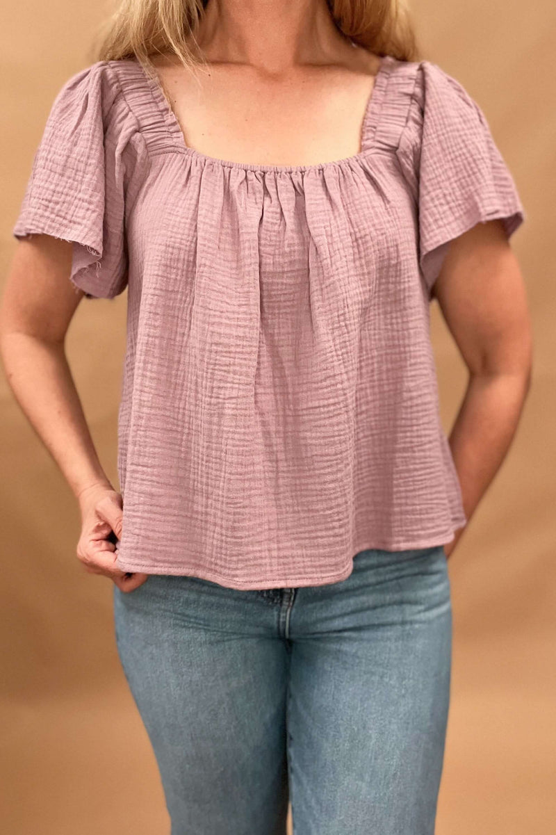 gauze lavender top raw cut sleeve, elastic at shoulders and chest 