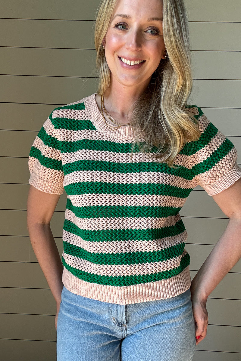 The close knit Green &amp; Blush Short Sleeve Top is the perfect blend of timeless style and everyday comfort. Crafted from 100% cotton, this breathable knit top offers a lightweight feel while maintaining a cozy texture. The intricate open-knit pattern showcases alternating green and blush stripes, creating a fresh and vibrant look.

With its classic crew neckline and ribbed trim on the sleeves and hem, this top provides a flattering and effortless fit. The short sleeves make it an easy transitional piece,