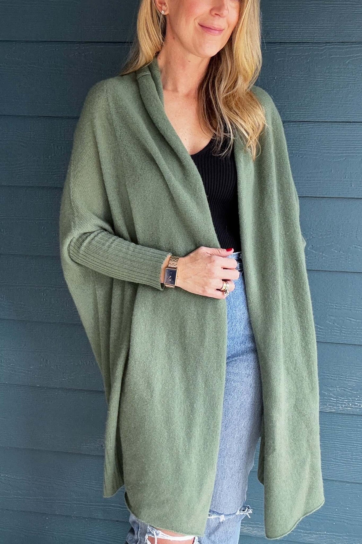 A cold weather must, this 100% cashmere long line cardigan fits snuggly on the forearms and cocoons out for a cozy &amp; flowy fit.

It is loose &amp; easy which makes a perfect layering piece.