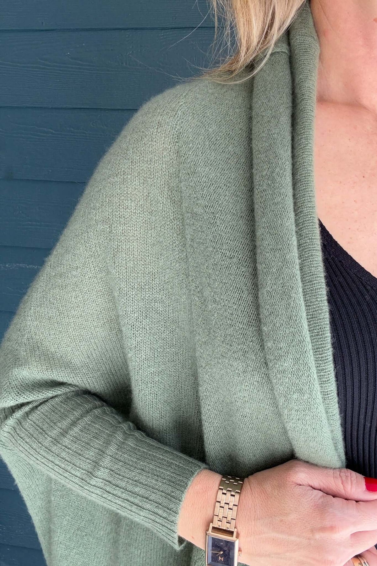 A cold weather must, this 100% cashmere long line cardigan fits snuggly on the forearms and cocoons out for a cozy &amp; flowy fit.

It is loose &amp; easy which makes a perfect layering piece.