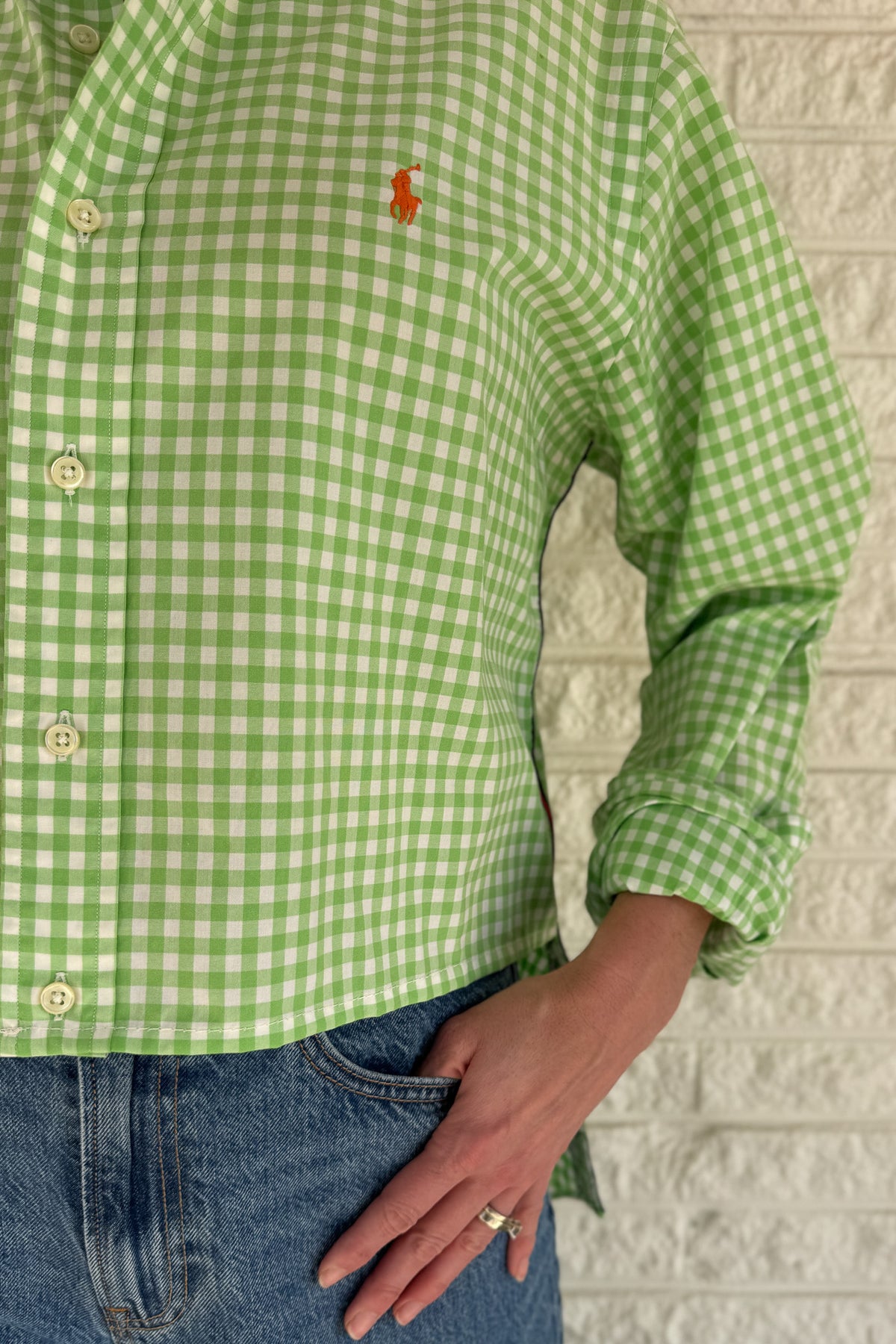 The modern Stormy button-down is designed to move with you for an easy, elevated feel. The cropped front flows into a longer back for a flattering high-low shape that adds interest to a classic style. Finished details give this piece a polished look that works dressed up or casual.