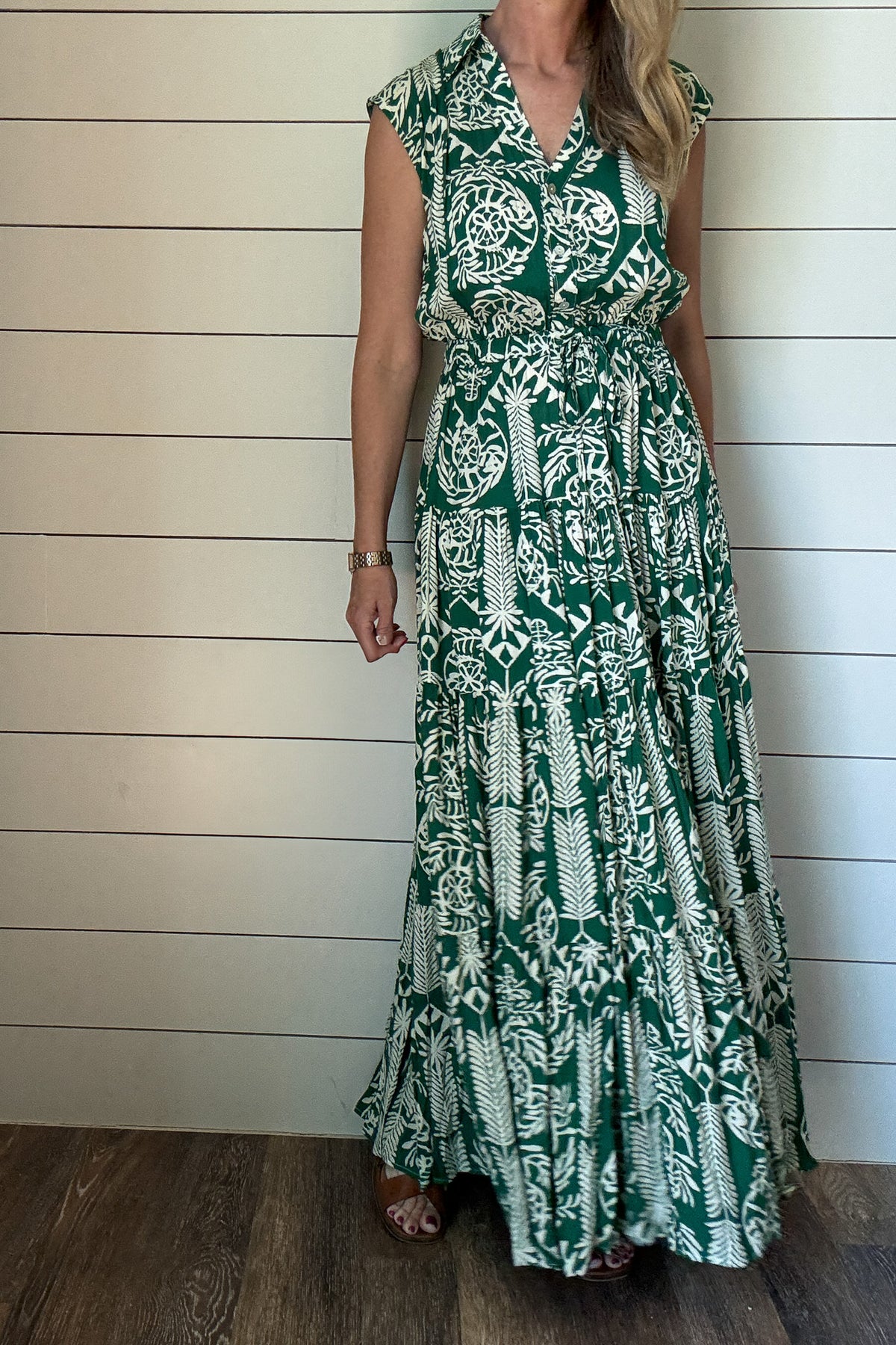 &nbsp;Meet your new favorite warm-weather dress. This green and cream print maxi is made from buttery soft fabric that drapes beautifully and feels like a dream. The tiered silhouette gives it an easy, flowy shape, and the drawstring waist lets you adjust for the perfect fit. A collared neckline and slightly capped sleeves keep the look polished, but still relaxed enough for everyday wear.