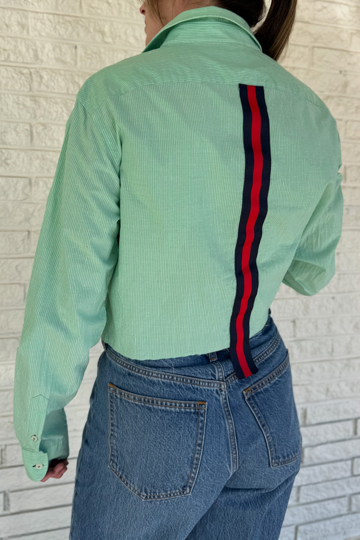 An upcycled men’s shirt reworked into a cropped, raw hem, easy silhouette that feels fresh and relaxed. Soft, feminine, and one-of-a-kind. Designed to be a one size fits most when worn open, wear it buttoned up and it fits like small or medium.