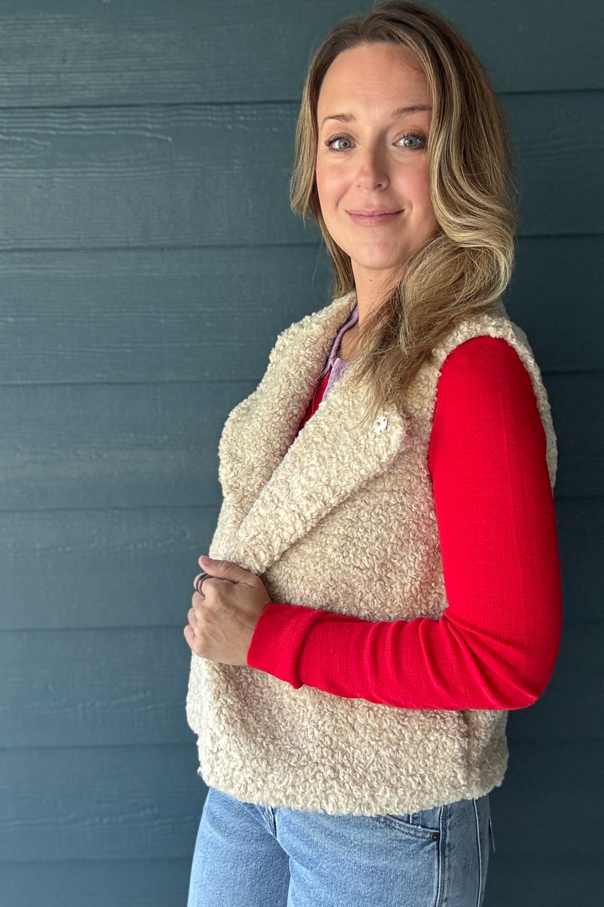 Close-up of Habitual Denim women’s cream faux sherpa vest with soft textured fabric and hidden snap front closure.