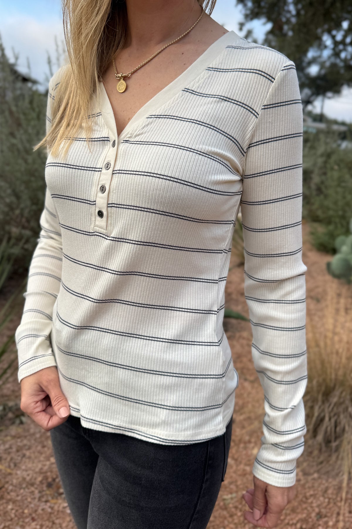 A timeless stripe with an easy, flattering fit,&nbsp; this ribbed henley top is a closet essential. The soft, stretchy knit moves with you while the button neckline adds a touch of laid-back polish. Perfect for layering or pairing with denim for effortless everyday style.