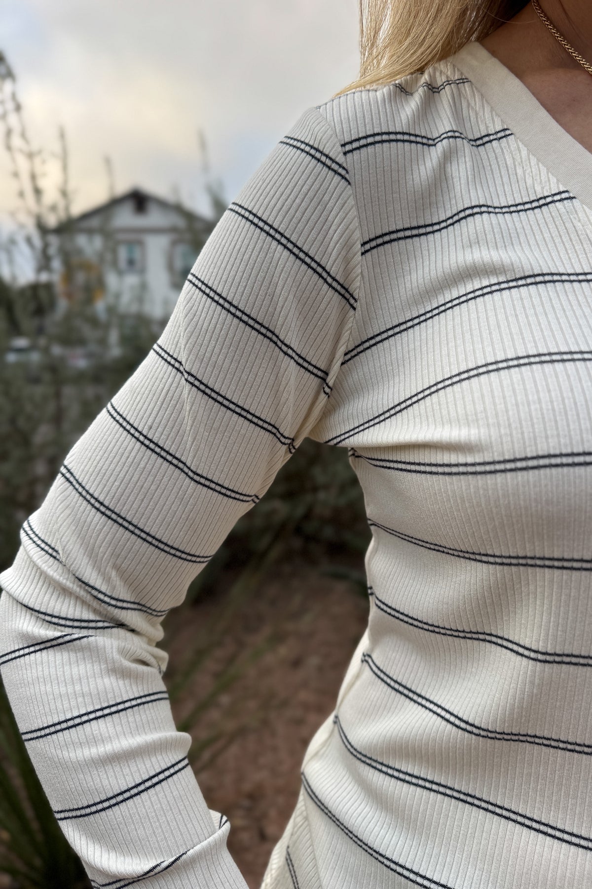 A timeless stripe with an easy, flattering fit,&nbsp; this ribbed henley top is a closet essential. The soft, stretchy knit moves with you while the button neckline adds a touch of laid-back polish. Perfect for layering or pairing with denim for effortless everyday style.
