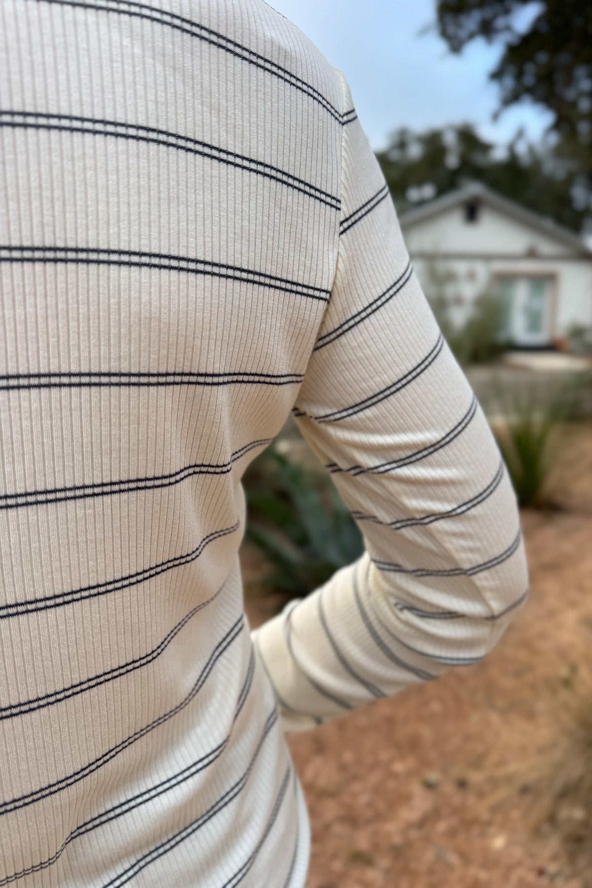 A timeless stripe with an easy, flattering fit,&nbsp; this ribbed henley top is a closet essential. The soft, stretchy knit moves with you while the button neckline adds a touch of laid-back polish. Perfect for layering or pairing with denim for effortless everyday style.