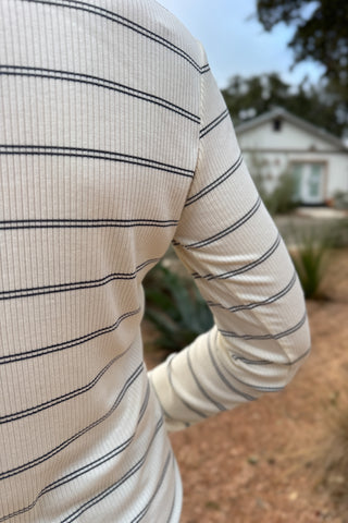 A timeless stripe with an easy, flattering fit,&nbsp; this ribbed henley top is a closet essential. The soft, stretchy knit moves with you while the button neckline adds a touch of laid-back polish. Perfect for layering or pairing with denim for effortless everyday style.
