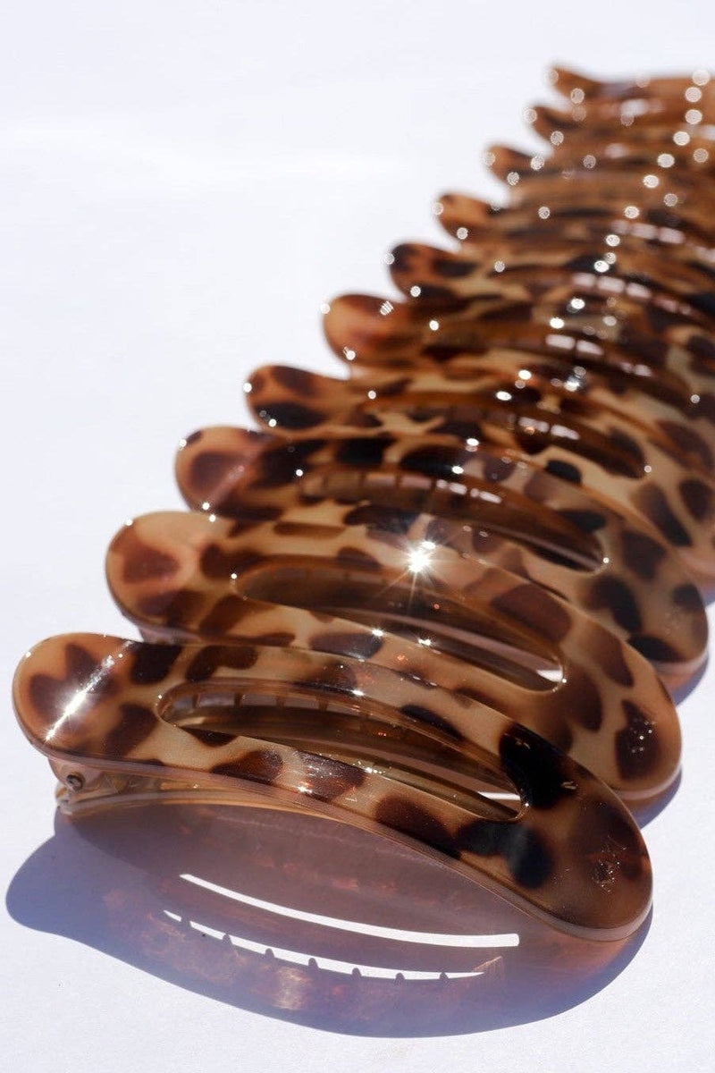 Tortoise shell hair comb on a white background