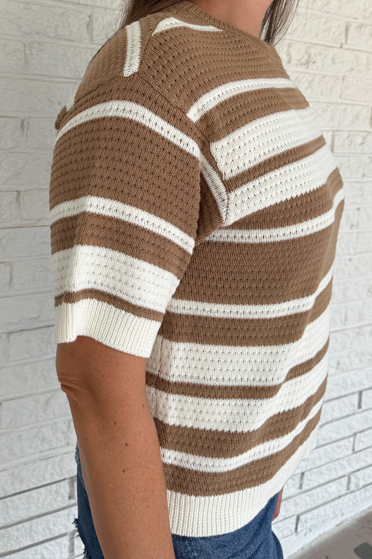 Classic stripes meet everyday comfort in this 100% cotton knit top. With its breathable open-knit texture and short sleeves, it’s an easy choice for effortless clothing that works from season to season. A timeless neutral palette keeps it versatile for everyday wear.