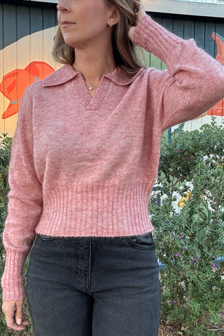 Women's heather pink collared knit sweater with a flattering slightly cropped silhouette and cozy long sleeves. Styled with black denim at Cotton & Cashmere in Blanco, Texas.