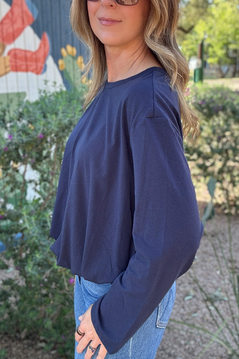 Casual navy blue pullover top for women featuring long sleeves, a loose silhouette, and an easy everyday fit.