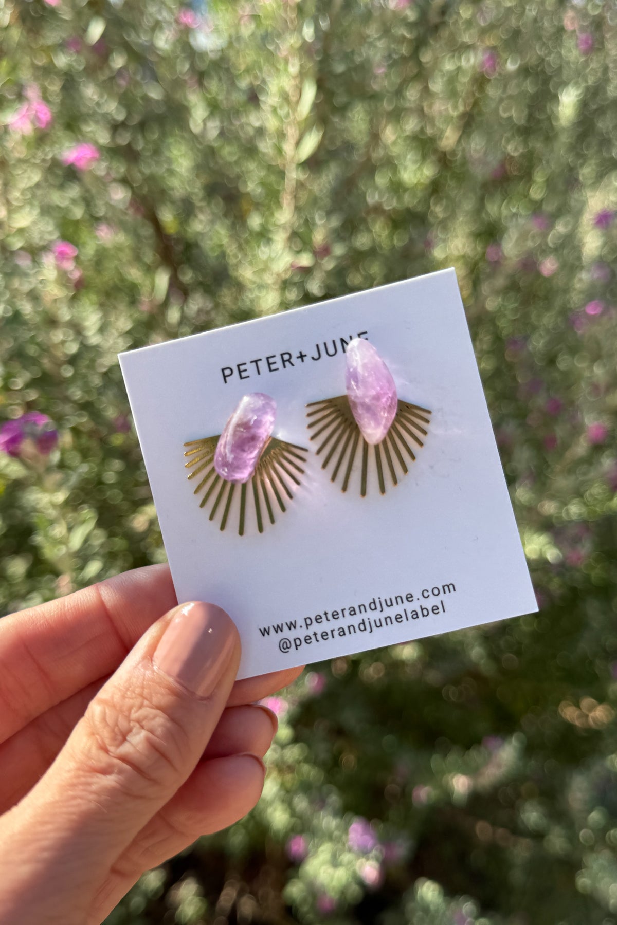 These earrings blend natural charm with modern design. A layer able (wear it in front or behind your ear lobe) raw brass burst fans out behind a polished lavender stone for a look that’s both bold and delicate. Lightweight and easy to wear, they bring an effortless pop of color to everyday outfits or evening style.