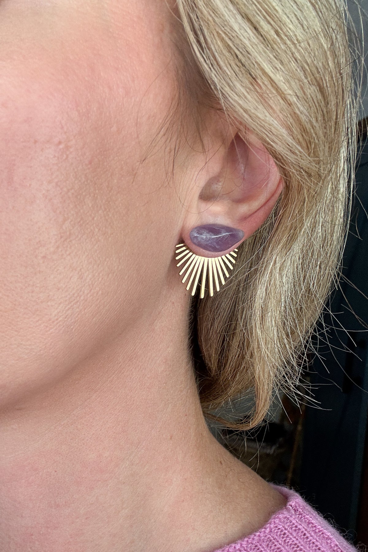 These earrings blend natural charm with modern design. A layer able (wear it in front or behind your ear lobe) raw brass burst fans out behind a polished lavender stone for a look that’s both bold and delicate. Lightweight and easy to wear, they bring an effortless pop of color to everyday outfits or evening style.