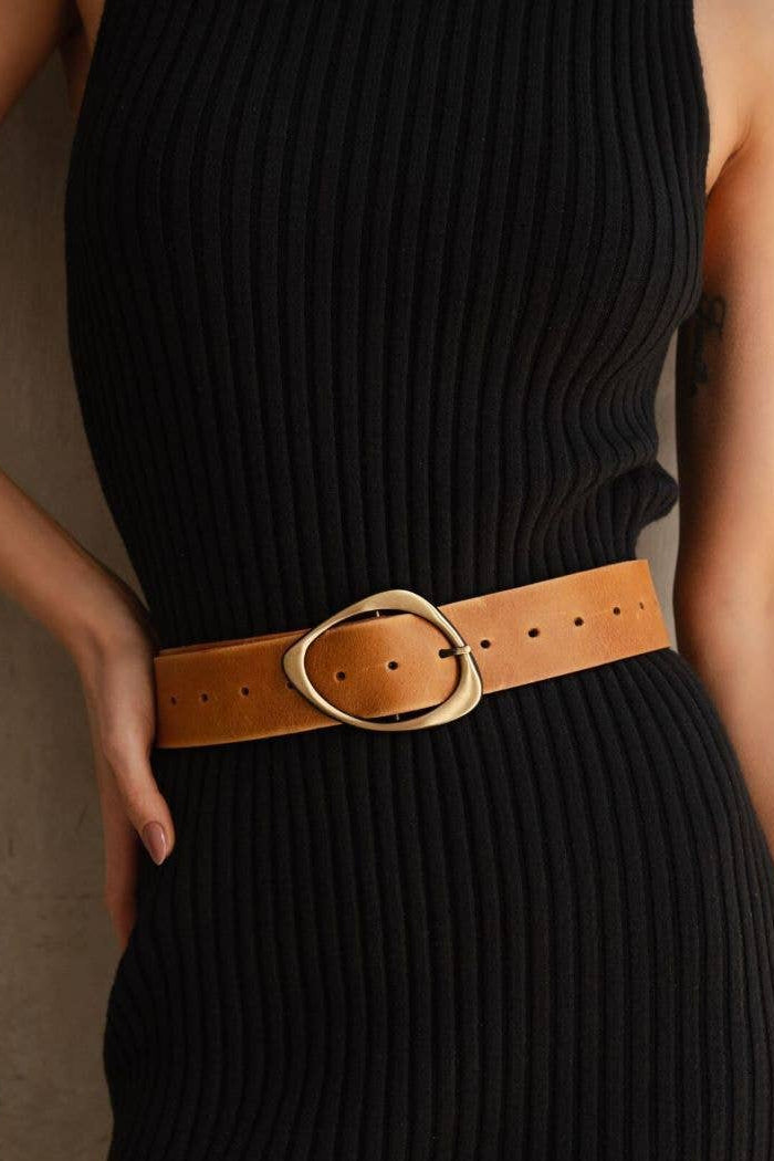 Elevate your look with this timeless leather belt. Designed from premium leather, it features a distinctive buckle that adds a stylish edge to any outfit. Available in rich cognac, it pairs perfectly with both casual and dressy styles.